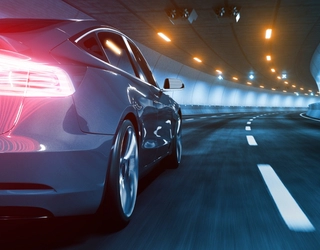 Blue EV car on road