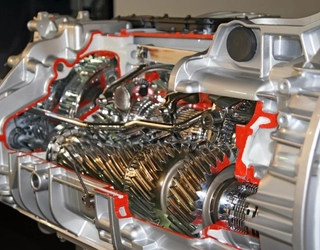 Car gearbox with gold cogs